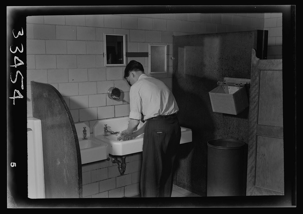 Keysville, Virginia. Randolph Henry High School. A student washing his hands in the lavatory. Sourced from the Library of…