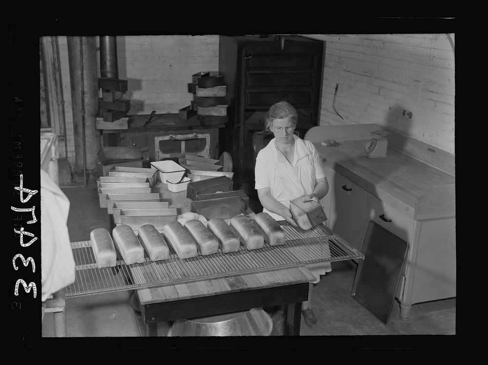 Keysville, Virginia. Baking bread in central bakery; seventy-five loaves each day to be sent to schools via school buses.…
