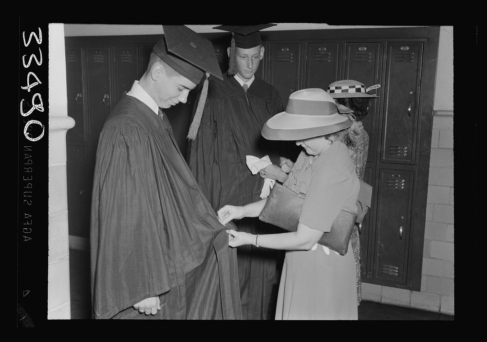 Keysville, Virginia. Randolph Henry High School. Mother adjusting a boy's robe before graduation. Sourced from the Library…