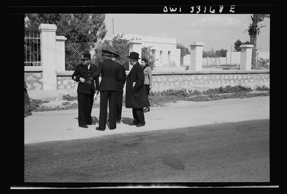 [Untitled photo, possibly related to: Sfax, Tunisia. Archbishop Spellman of New York talking with French officials on the…