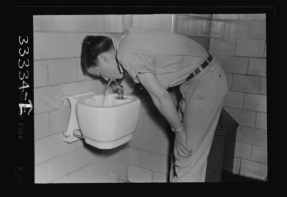 Keysville, Virginia. Randolph Henry High School. Boy at the drinking fountain. Sourced from the Library of Congress.