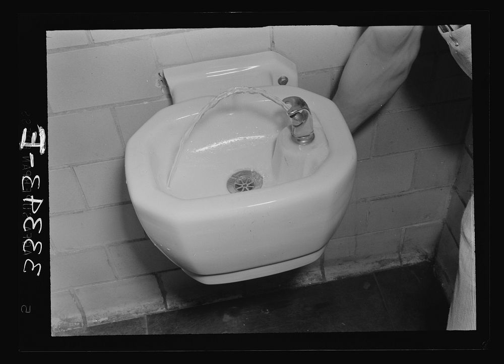 [Untitled photo, possibly related to: Keysville, Virginia. Randolph Henry High School. Boy at the drinking fountain].…
