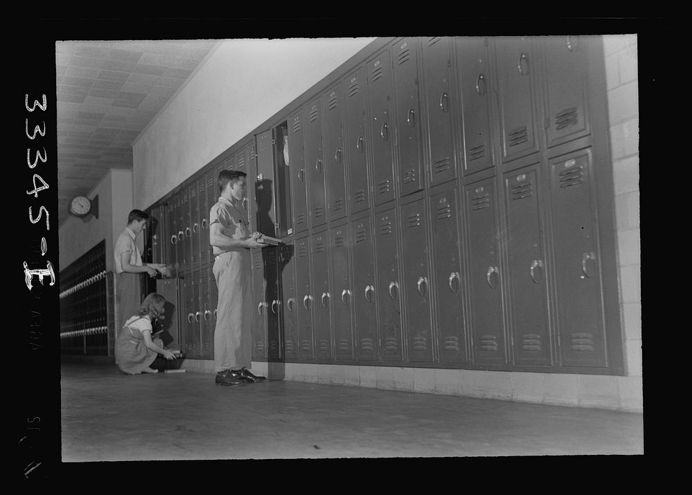 [Untitled photo, possibly related to: Keysville, Virginia. Randolph Henry High School. At lockers between classes]. Sourced…