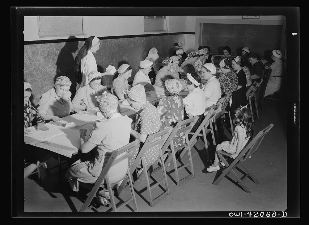 Southington, Connecticut. A group of women rolling bandages and preparing surgical dressings. Sourced from the Library of…