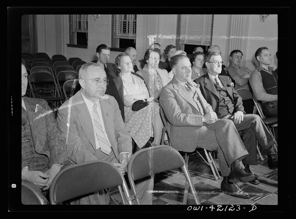 Southington, Connecticut. First Selectman (for 1942) James Simone (left) attending the town meeting in his capacity as…