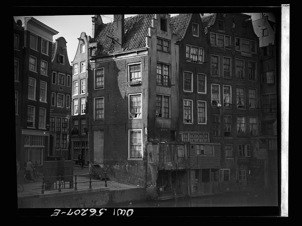 Amsterdam, Netherlands. Houses along the canal near the market district. Sourced from the Library of Congress.