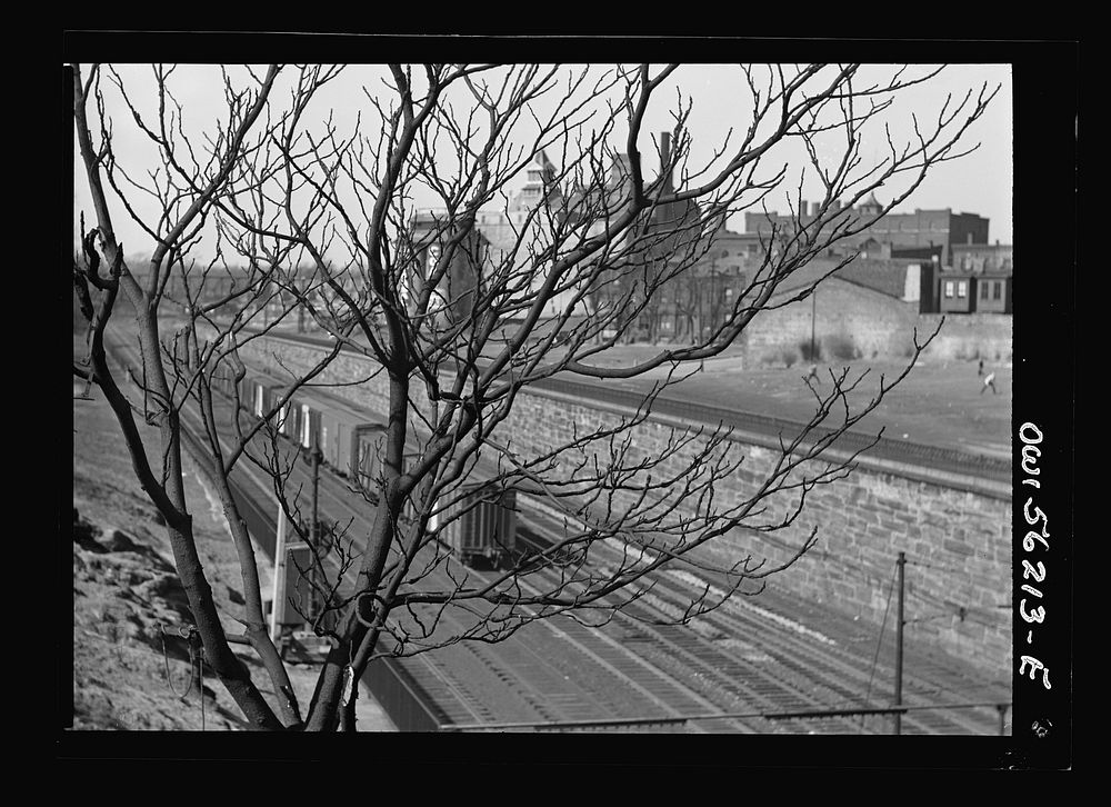 Philadelphia, Pennsylvania. Reading Railroad tracks with an abandoned brewery in the background. Sourced from the Library of…
