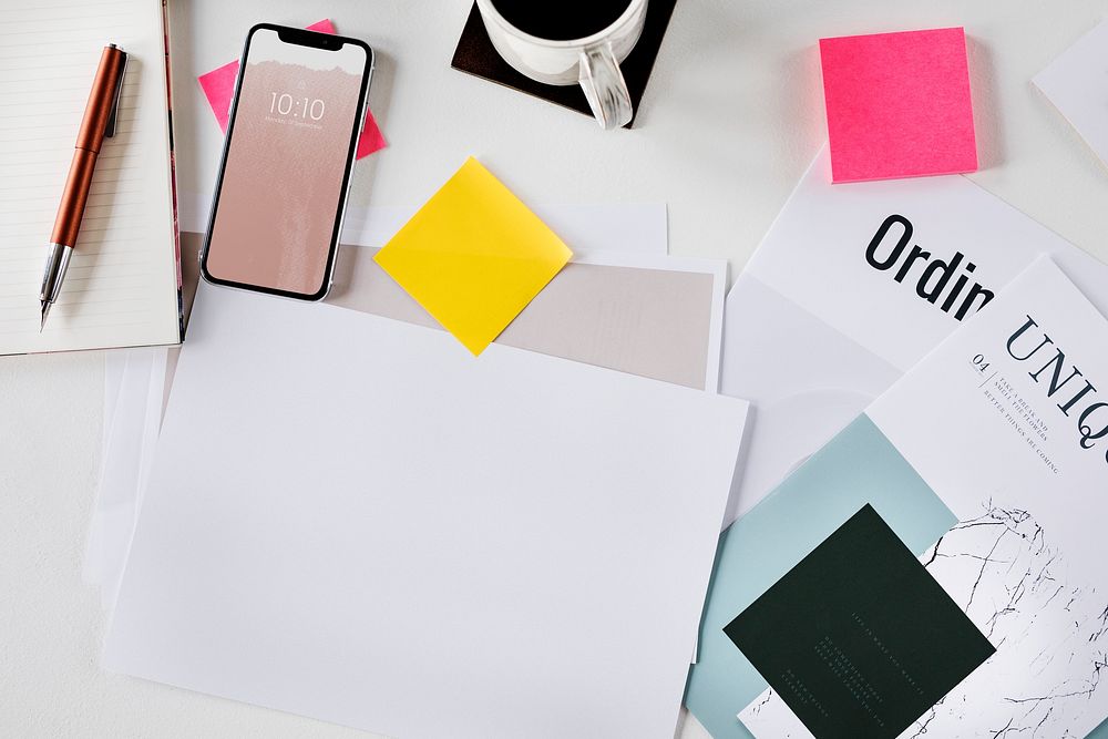 Blank white paper on a messy table