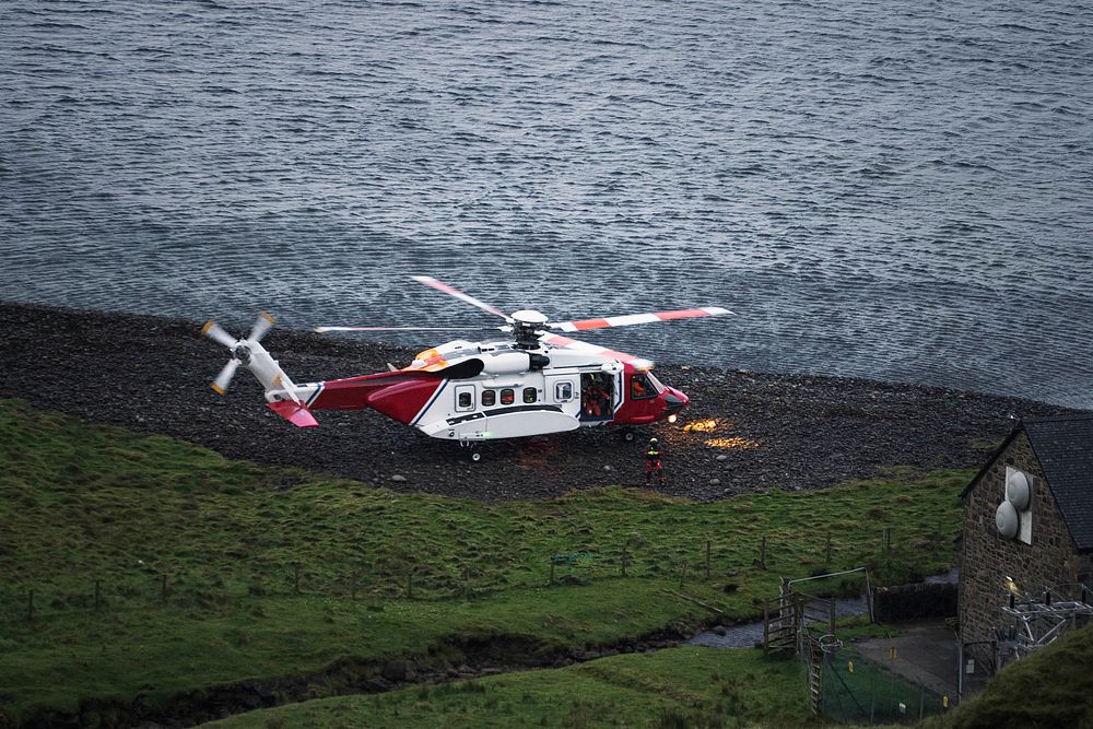 Coastguard helicopter landing on the island in Scotland