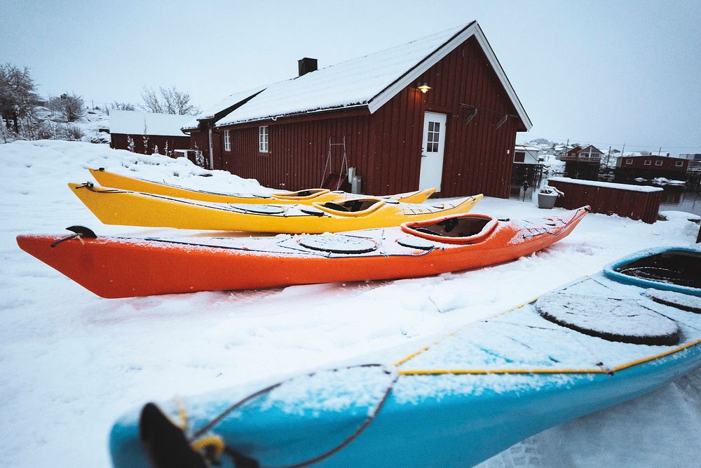 Kayaks in front of a fishing house in Lofoten, Norway