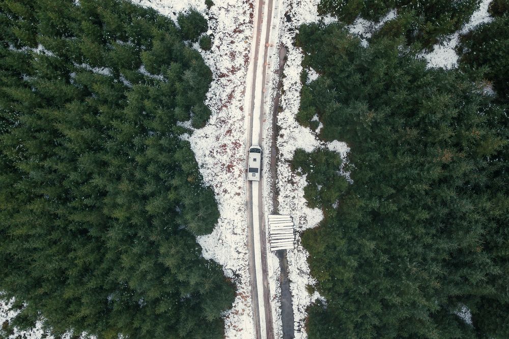 Drone shot of a snowy road in the Trossachs, Scotland