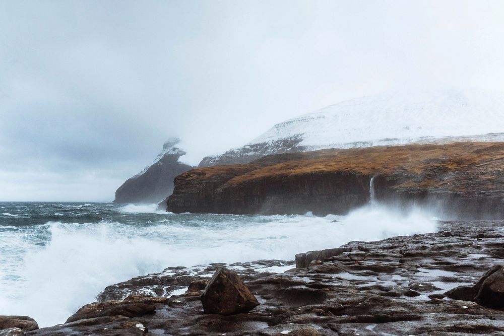 Stormy waves hitting the cliffs at Molin beach on Streymoy island, Faroe Islands