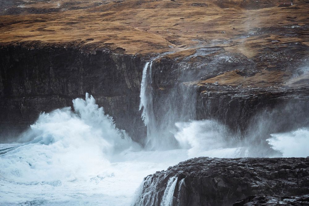 Stormy waves hitting the cliffs at Molin beach on Streymoy island, Faroe Islands