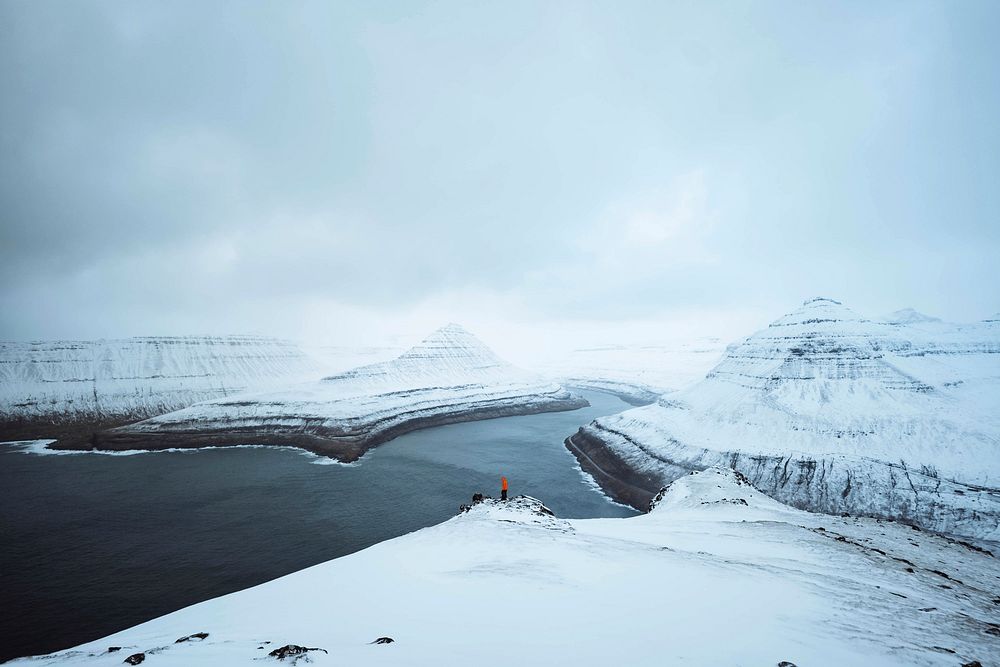 View of snowy Hv&iacute;thamar mountain in the Faroe Islands on a misty day
