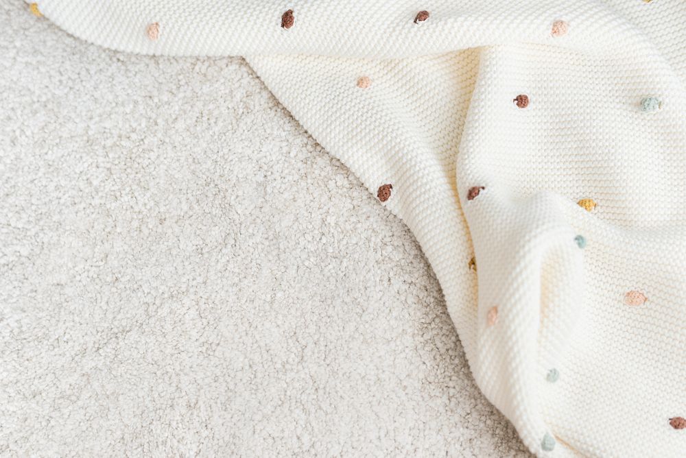 Baby blanket on the floor with design space