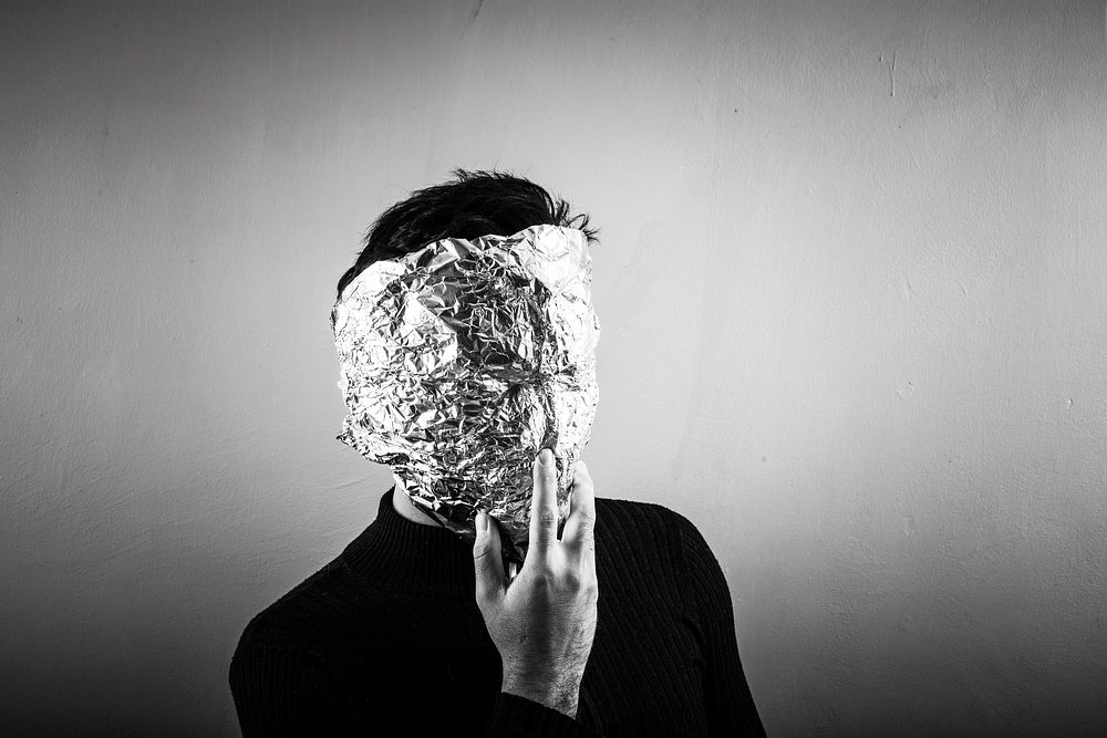 Free man covering face with foil image, public domain human CC0 photo.