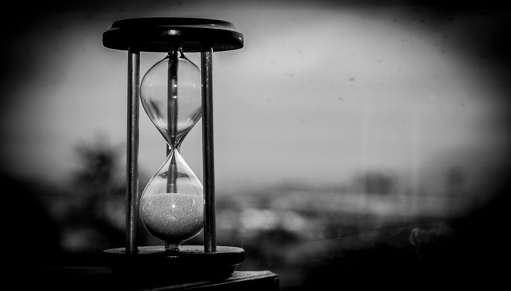 Free hourglass clock in black and white image, public domain CC0 photo.