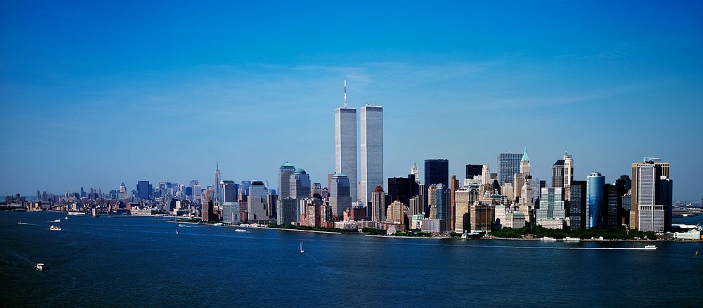 Aerial view of New York City, in which the World Trade Center Twin Towers is prominent. Original image from Carol M.…