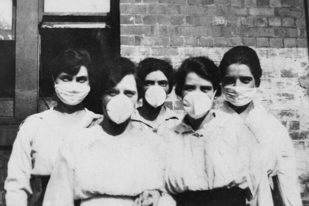 Women wearing surgical masks during the influenza epidemic, Brisbane (1919). Original image from State Library of…