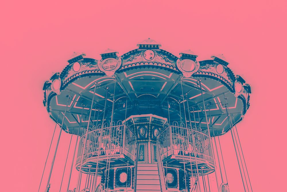 Blue carousel on a pink background