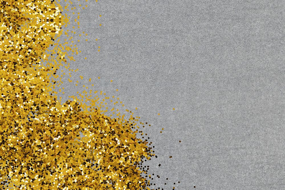 Shimmering gold confetti on a gray background 