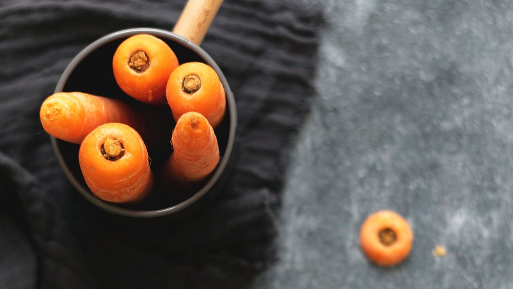 Fresh carrots in a cup food photography
