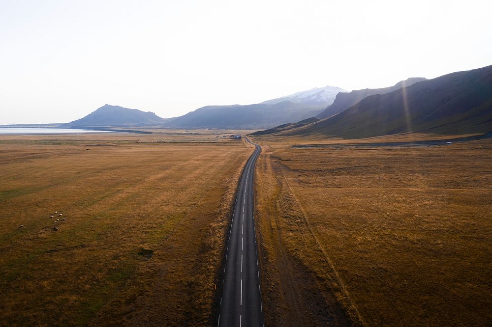Road on the countryside on a misty day drone shot