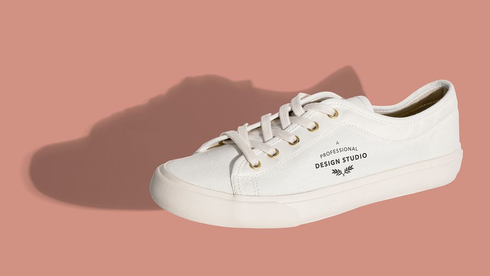 Unisex white sneakers mockup on a pink background