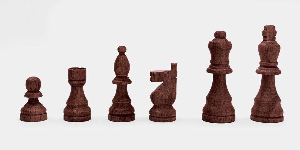 Dark wood chess pieces mockup on a gray background