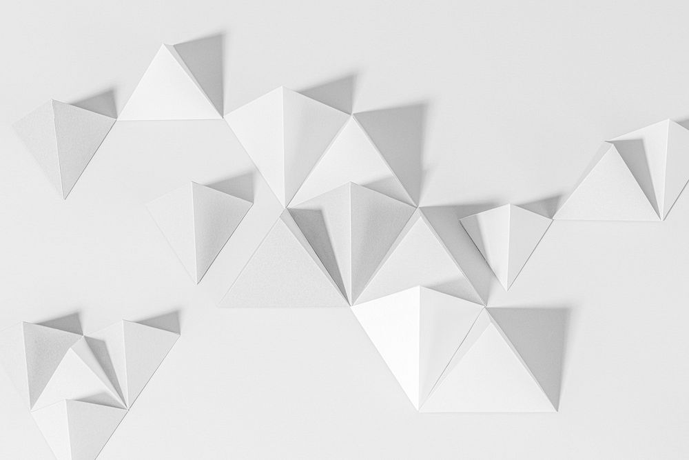3D gray pyramid paper craft on a gray background