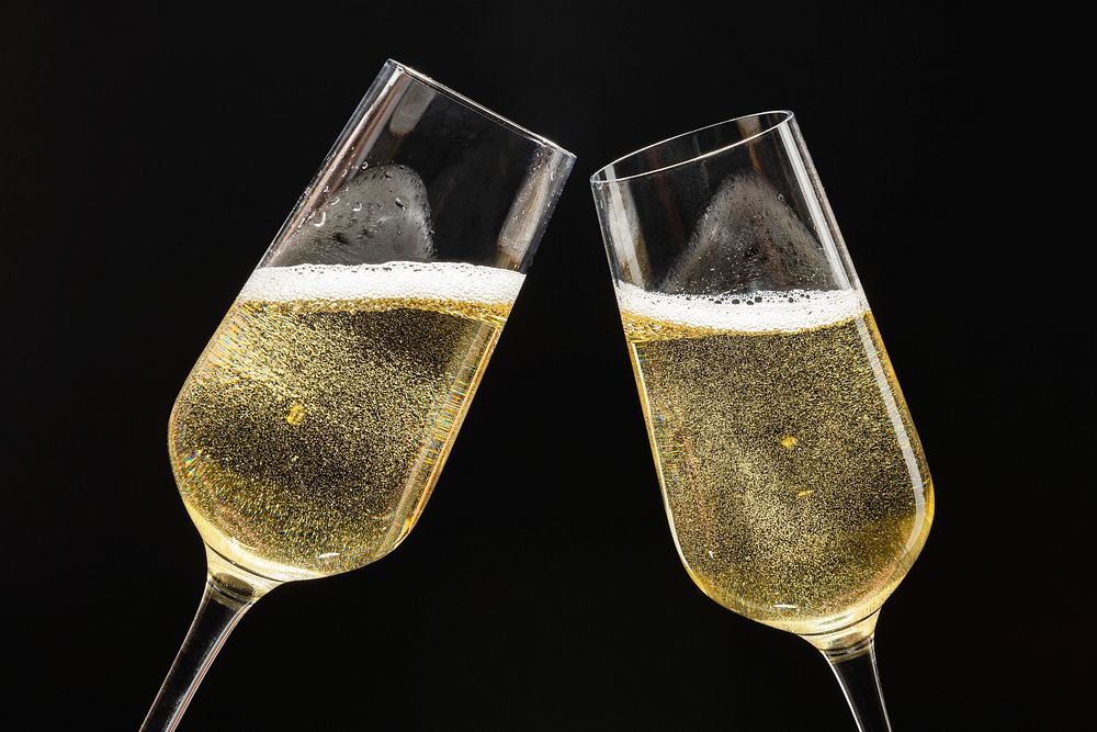 Two festive champagne glasses celebration