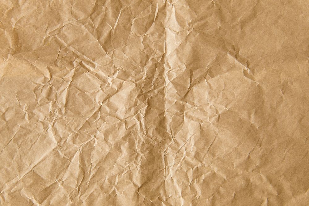 Crumpled brown paper textured background