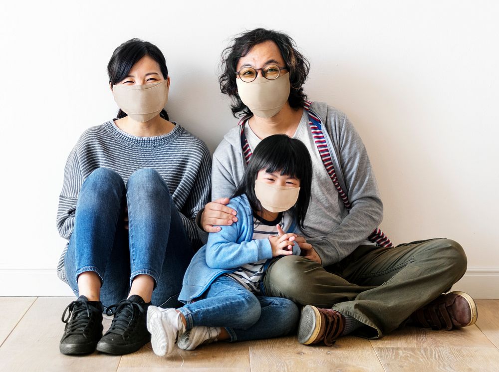 Japanese family wearing face masks inside the house