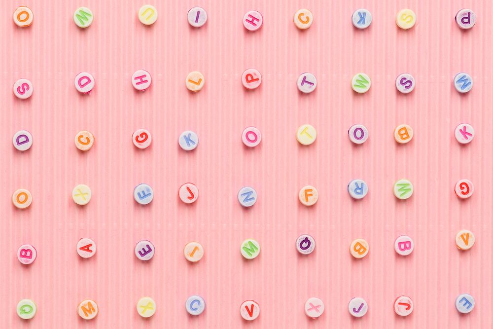 Letter beads pattern pink background