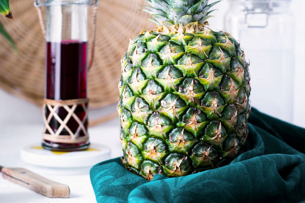 Organic pineapple on white table 