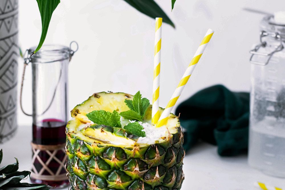 Pineapple drink with coconut cranberry syrup