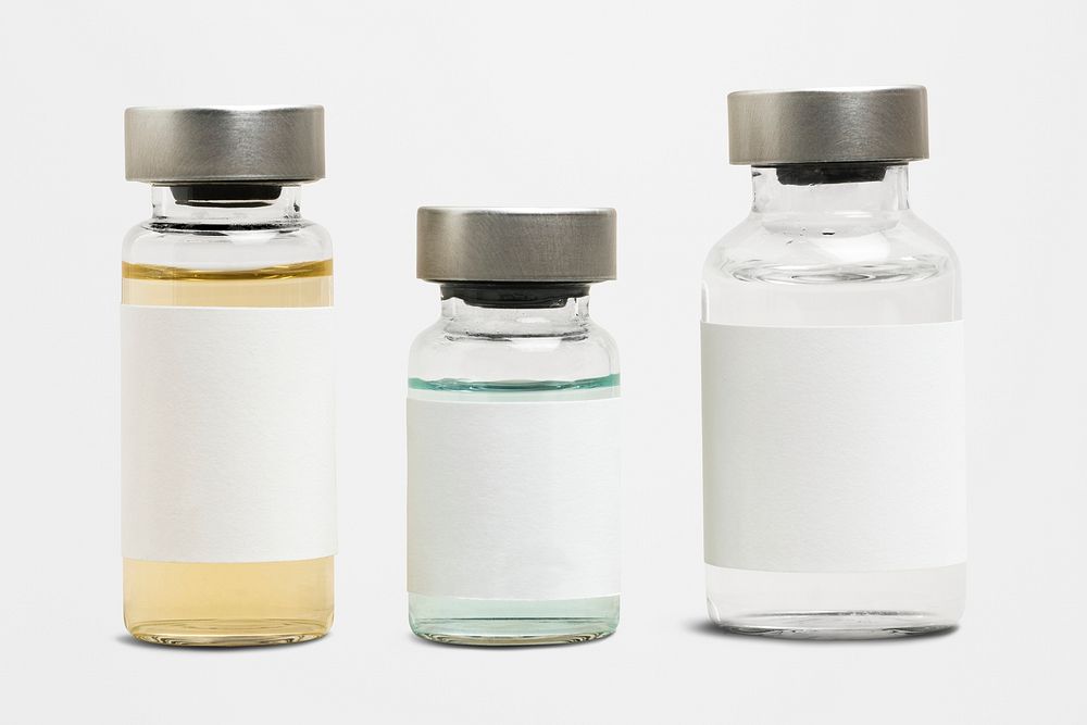 Blank vaccine label on injection glass bottles with colored liquid