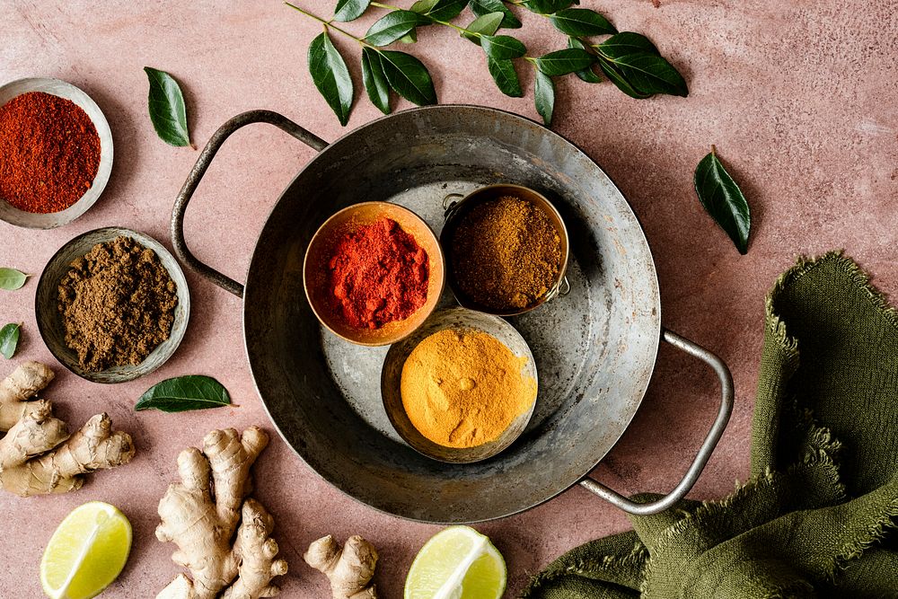 Curry spice ingredients butter chicken on a tray food photography flat lay