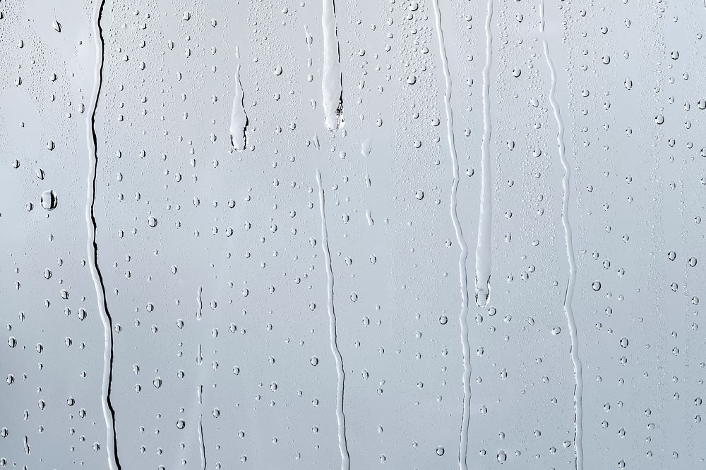 Water texture background, rainy window on cloudy day