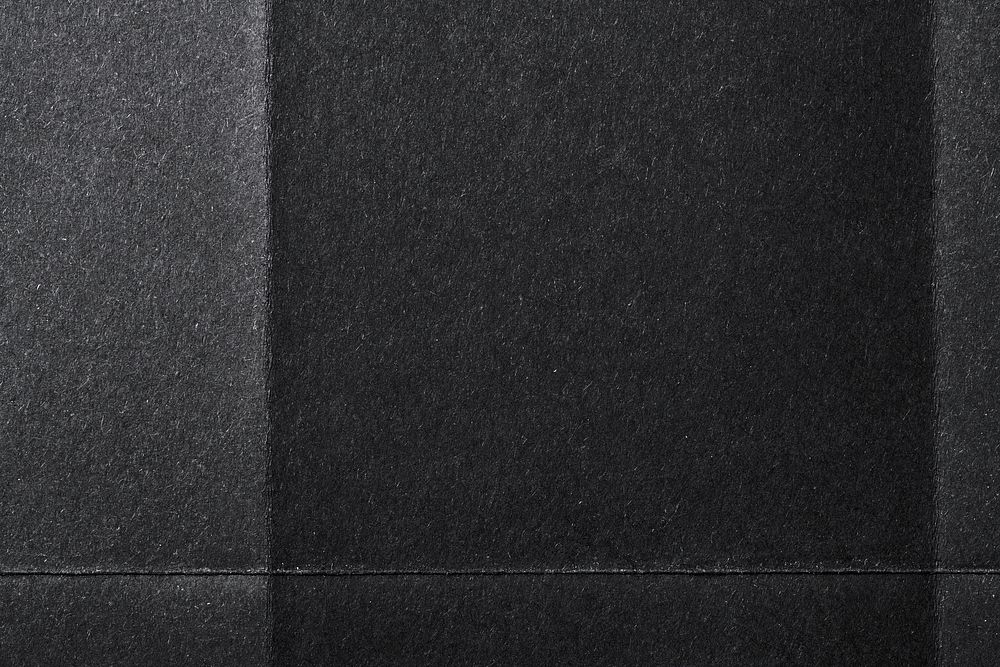 Folded black paper texture background