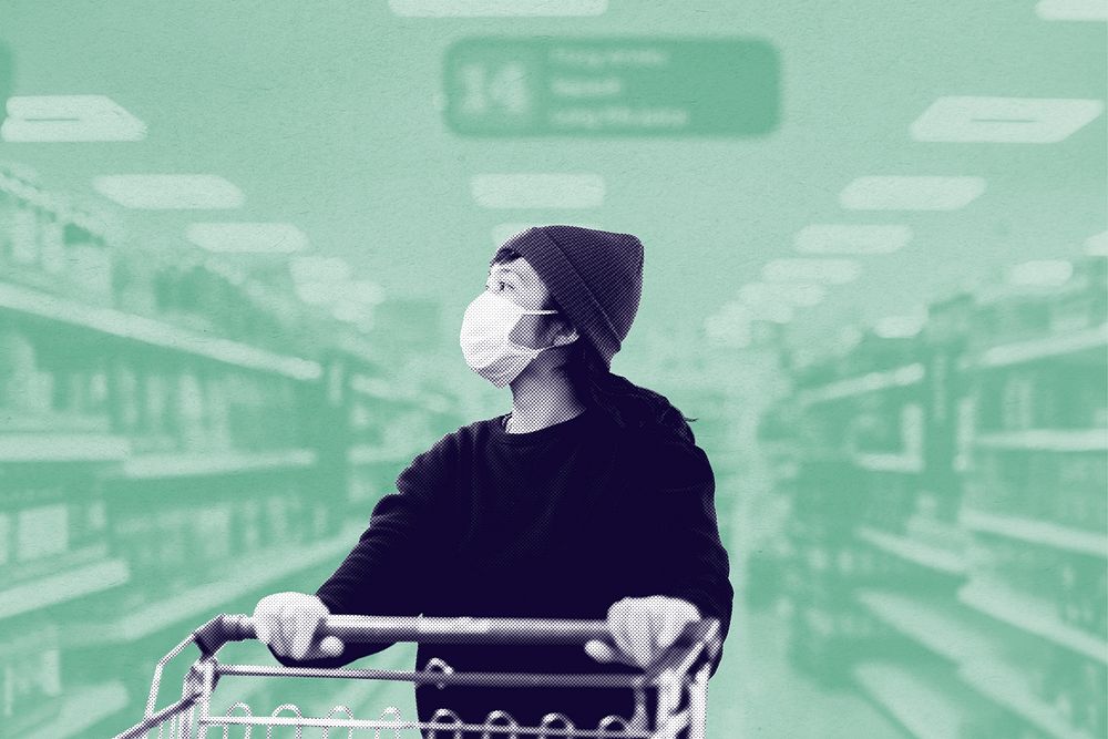 Woman with a face mask buying food in a supermarket during coronavirus pandemic