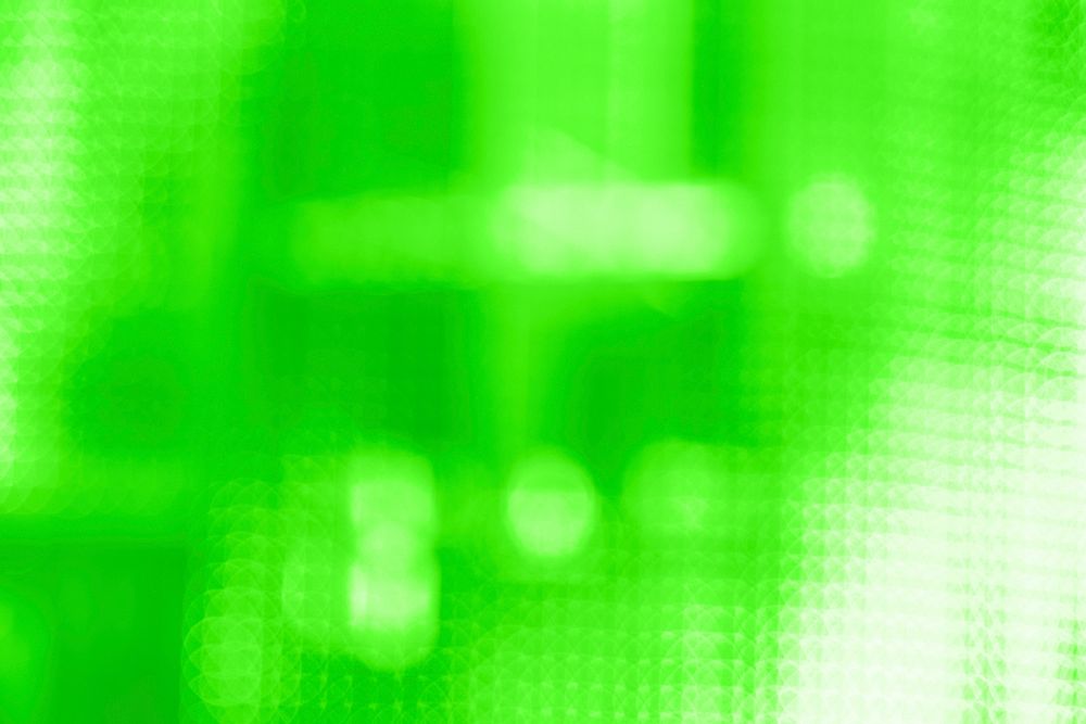 Bokeh pattern on a bright green mosaic background