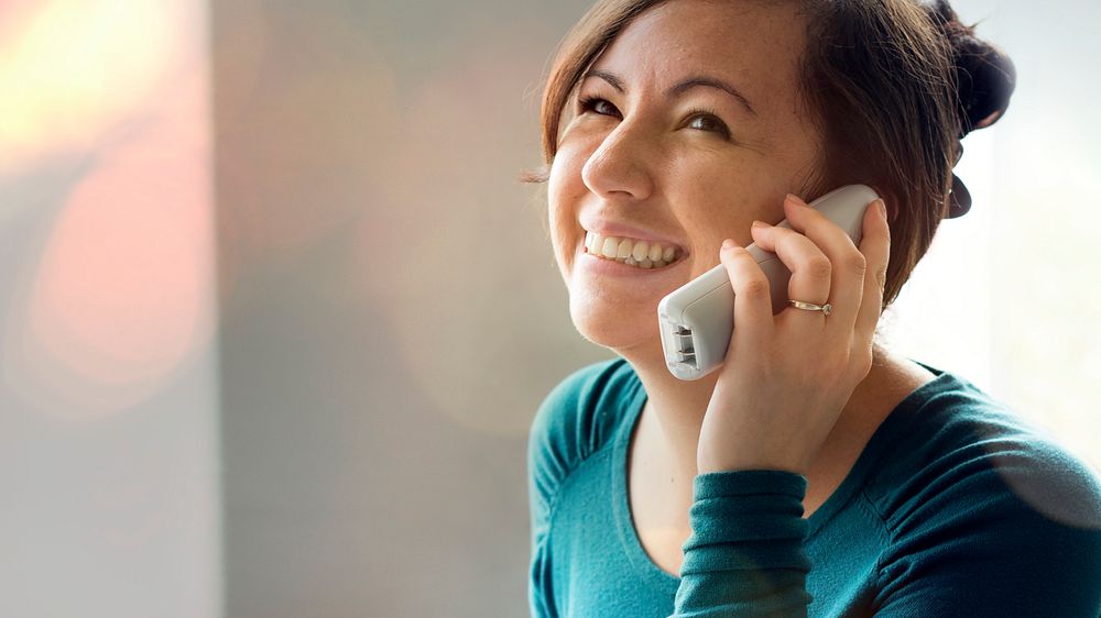 Cheerful woman talking on the phone