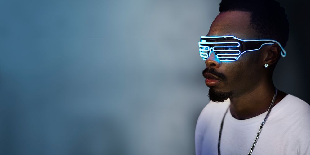 Young man wearing futuristic led glasses
