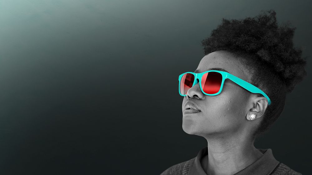Black woman wearing teal sunglasses