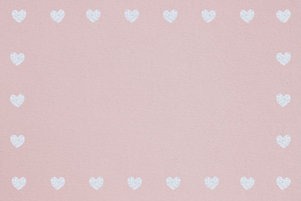 Silver heart patterned frame on a dull pink background