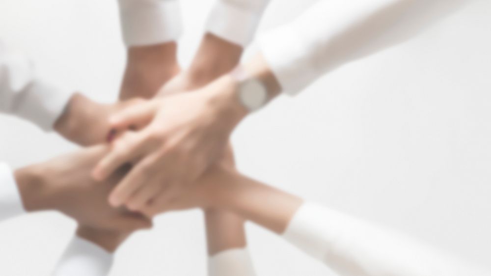 Successful business teamwork joining hands