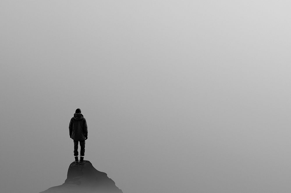 Man standing on top of a hill