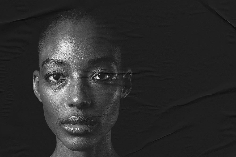 Black model closeup on black background studio shoot
