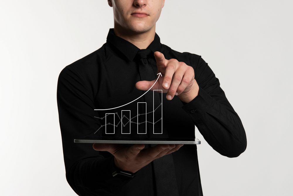 Futuristic digital graph presentation by a businessman in black shirt